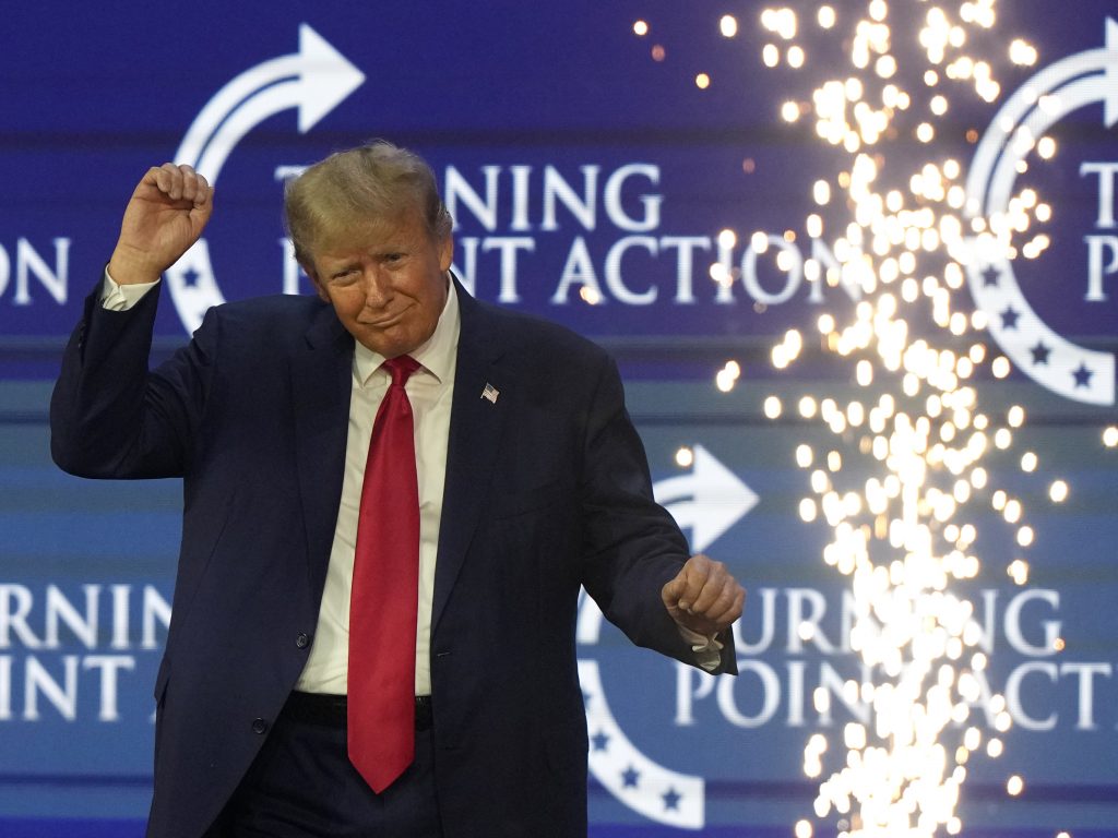 Former President Donald Trump dances on stage at the Turning Point Action conference on July 15, in West Palm Beach, Fla.