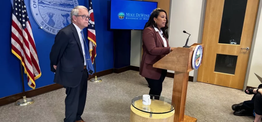 Alisha Nelson speaks at podium after Gov. Mike DeWine names her executive director of OneOhio Recovery Foundation