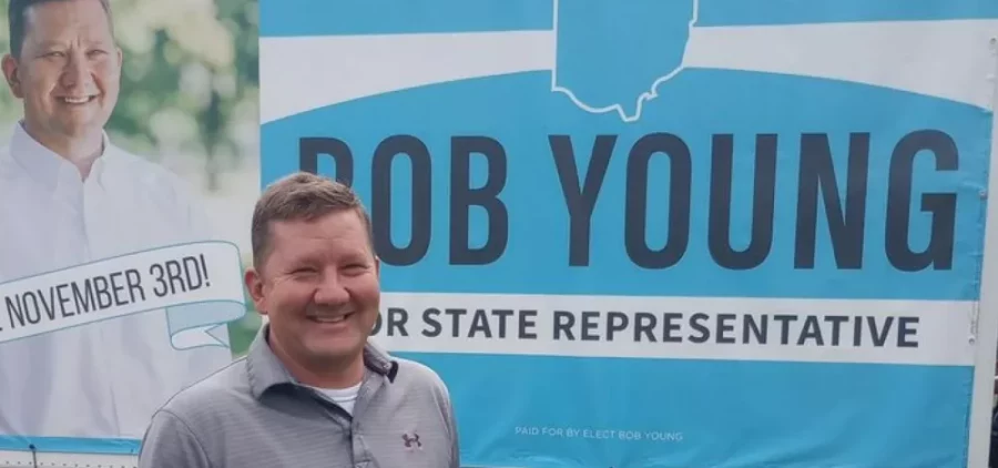 Rep. Bob Young (R-Green), in a picture posted on Facebook in September 2022 poses in front of a truck with his campaign sign on it.