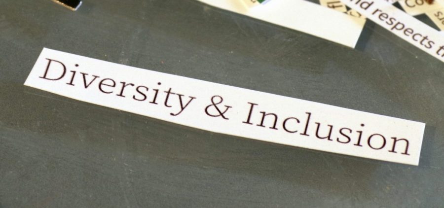 A strip of paper reads "Diversity and Inclusion"