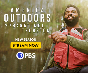 American Outdoors passport web button, Baratunde Thurston in red life jacket rowing boat.