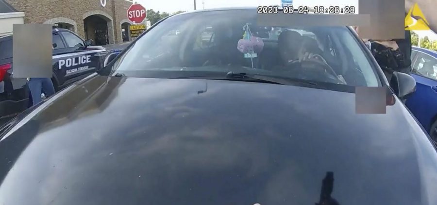 from a bodycam showing an an officer pointing his gun at Ta'Kiya Young moments before shooting her through the windshield outside a grocery store in Blendon Township, Ohio, a suburb of Columbus, on Aug. 24.