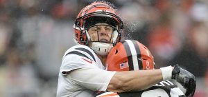 Cincinnati Bengals quarterback Joe Burrow, left, is hit by Cleveland Browns safety Grant Delpit, right, as he throws during the second half of an NFL football game Sunday, Sept. 10, 2023, in Cleveland.