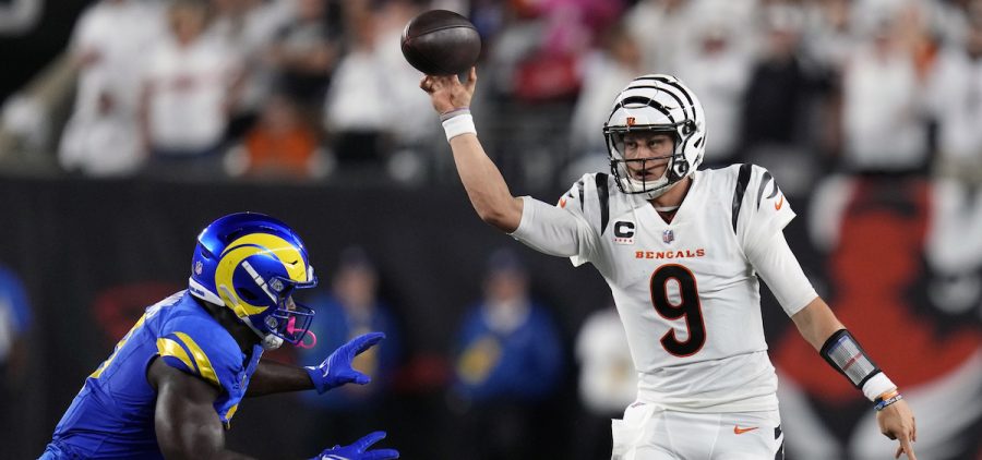 Cincinnati Bengals quarterback Joe Burrow, right, throws over Los Angeles Rams outside linebacker Byron Young during the second half of an NFL football game Monday.