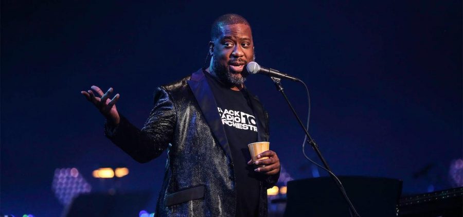 Robert Glasper, five-time Grammy Award-winning pianist, composer, and producer on stage at mic talking