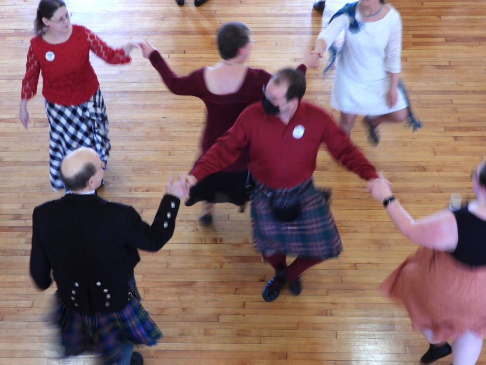 An image of people in a dance studio practicing Scottish dance.