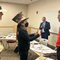 Environmental activist Roxanne Groff of Save Ohio Parks talks to Oil and Gas Land Management Commissioner Matthew Warnock, an appointee representing the oil and gas industry, following the meeting on Sept. 18, 2023.