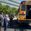 At the first meeting of the Ohio School Bus Safety Working Group, Ohio Highway Patrol Lt. Aaron Reimer opens up the back of a school bus to demonstrate to the board and governor mike DeWine the inspection done on buses.