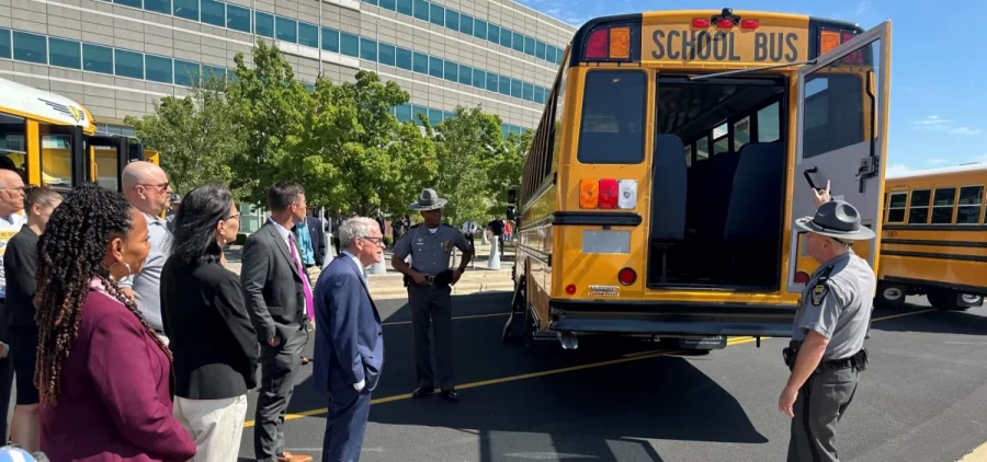 At the first meeting of the Ohio School Bus Safety Working Group, Ohio Highway Patrol Lt. Aaron Reimer opens up the back of a school bus to demonstrate to the board and governor mike DeWine the inspection done on buses.