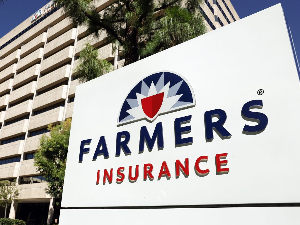 The Farmers Insurance logo is displayed outside company headquarters in Woodland Hills, Calif.