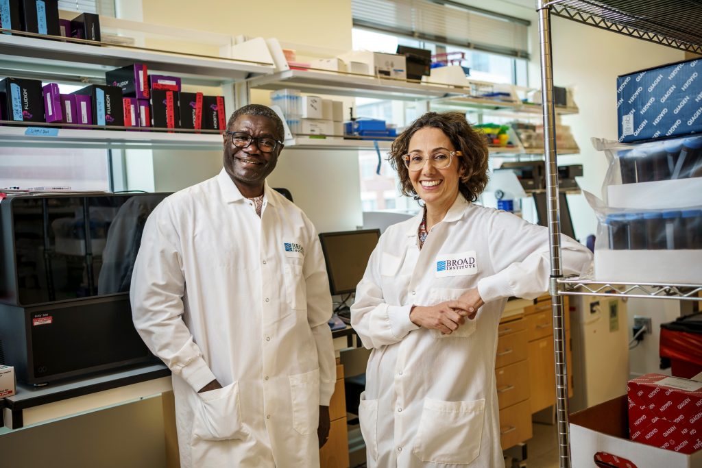 Long time collaborators Pardis Sabeti of the Broad Institute and Christian Happi who directs ACEGID, the African Centre of Excellence for Genomics of Infectious Diseases in Nigeria pose in together in a research lab.