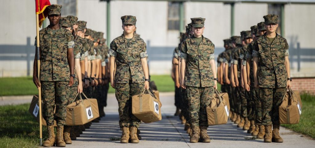 Marine recruits wait for their drill instructor as they cross the base at Marine Corps Recruit Depot, Parris Island on August 22 in Beaufort County, S.C.