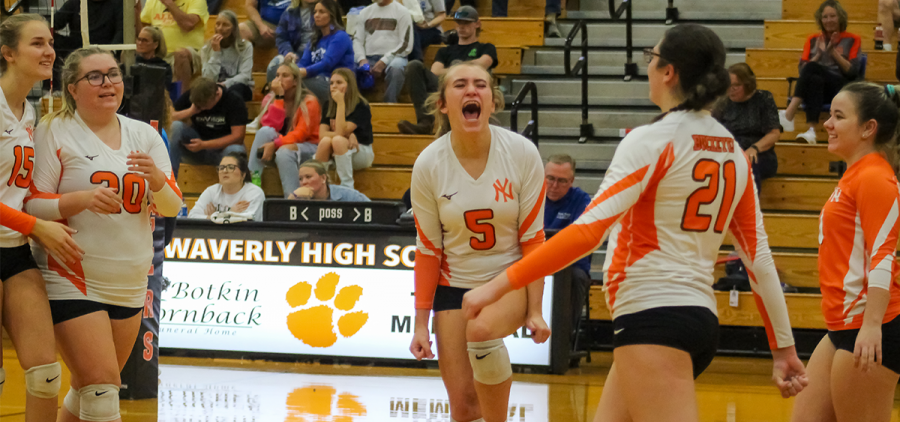Nelsonville-York Volleyball: Buckeye Kenzie VanBibber yells in celebration with four of her teammates after a point score