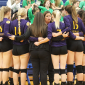 Southern Tornadoes volleyball: Southern head coach speaking to her players in a huddle during a timeout