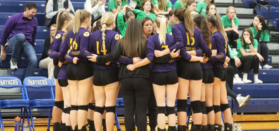 Southern Tornadoes volleyball: Southern head coach speaking to her players in a huddle during a timeout