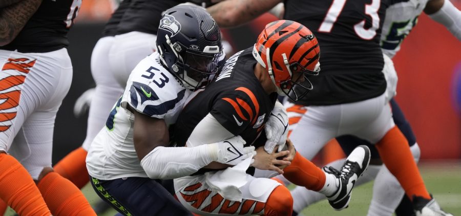 Joe Burrow is sacked by a Seattle defender during and NFL game.