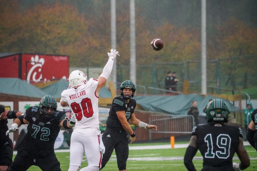 Quarterback Kurtis Rourke (7) throws a pass to Miles Cross (19) in Ohio's game against Miami. [Conor Mallonn | WOUB]