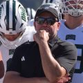 Ohio football head coach Tim Albin stands with his team before their game against San Diego State