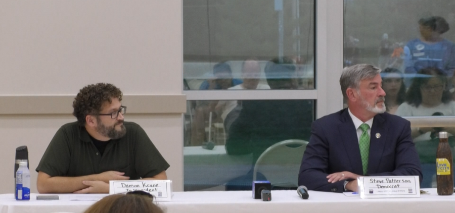 Mayor Steve Patterson and his opponent Damon Krane sitting at a table during the Athens County League of Women Voters mayoral candidate forum.