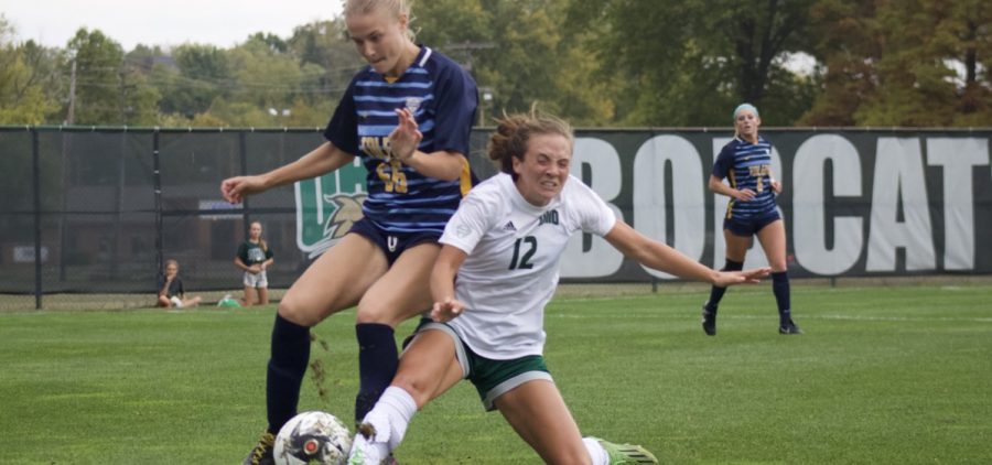 Ohio defender Rayann Pruss (12) battles for the ball against the Toledo Rockets