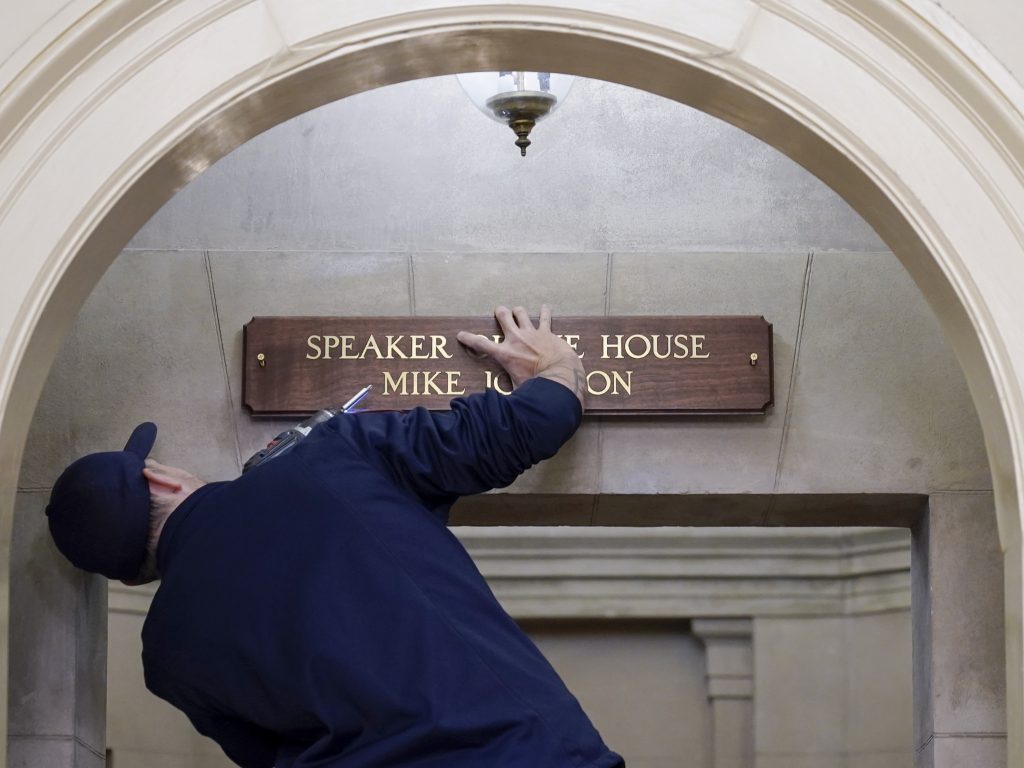 A new sign is installed above the entrance to the office of House Speaker Mike Johnson