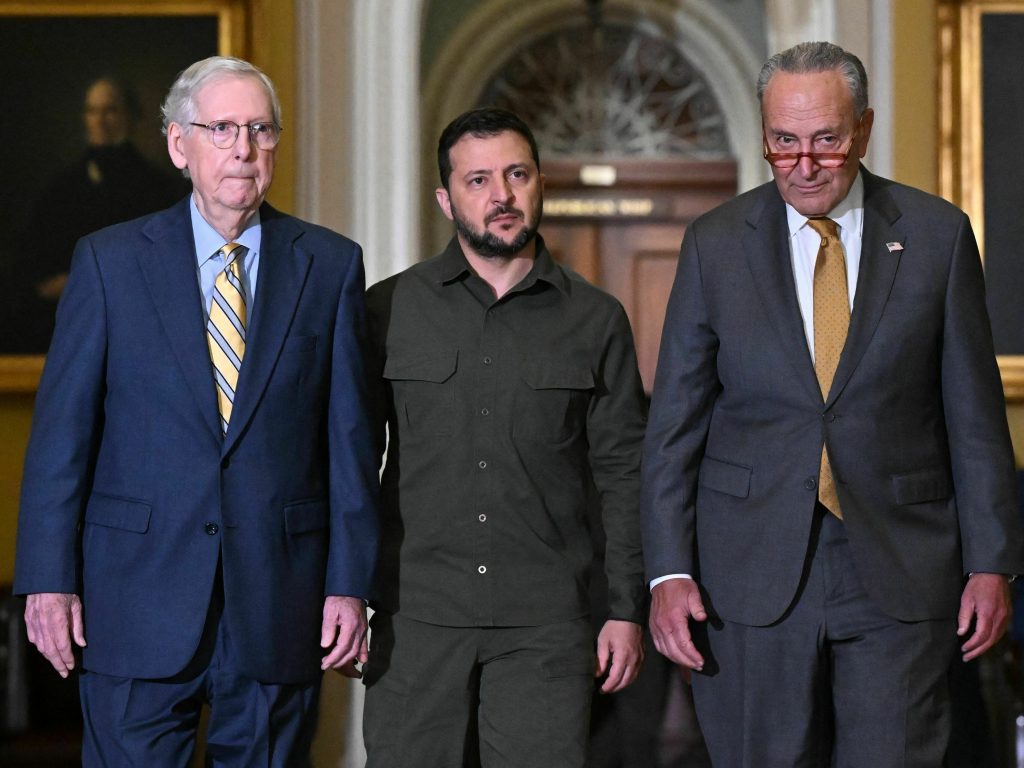 Ukrainian President Volodymyr Zelensky (center) walks with Senate Majority Leader Chuck Schumer (right) and Senate Minority Leader Mitch McConnell (left) during a trip to Washington last month.