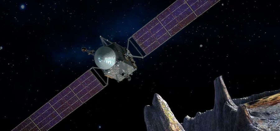 An artist's conception of the Psyche spacecraft approaching an asteroid