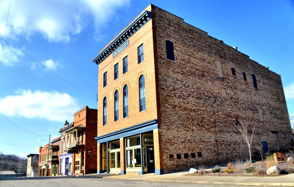 An image of the Tecumseh Theater, which is a brick building.