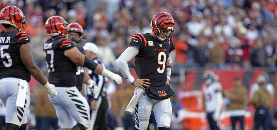 Cincinnati Bengals quarterback Joe Burrow (9) looks down after being sacked during the second half of an NFL football game against the Houston Texans.