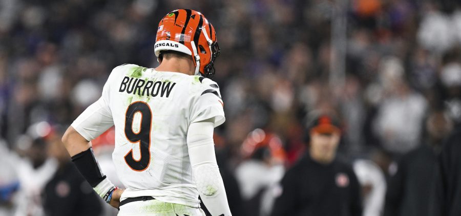 Cincinnati Bengals quarterback Joe Burrow (9) flexes his right hand after an apparent injury during the first half of an NFL football game against the Baltimore Ravens