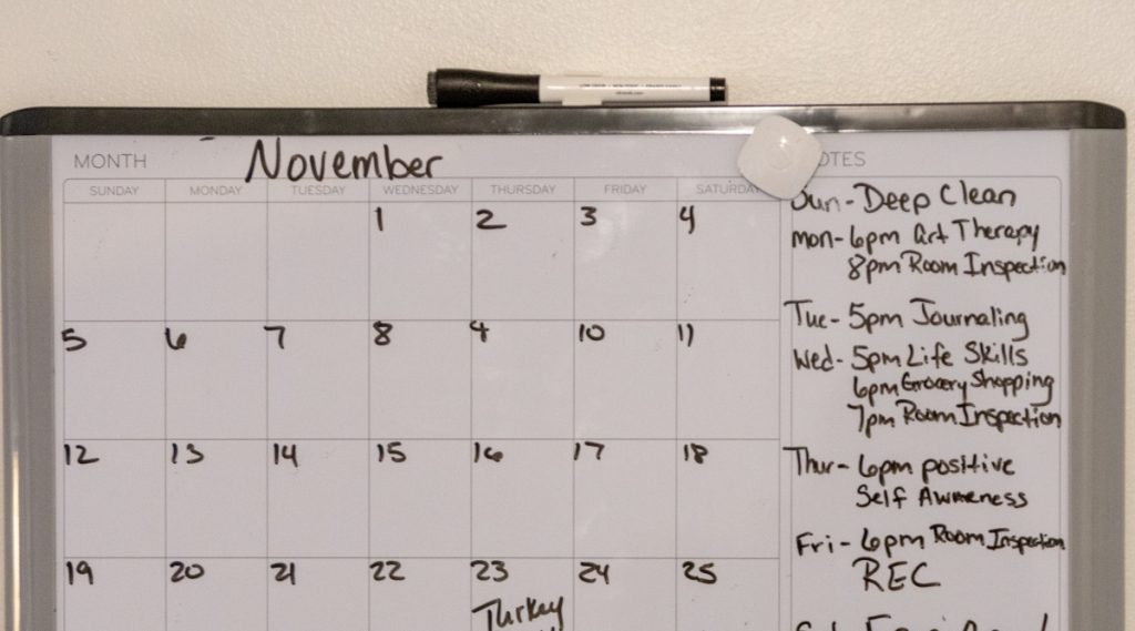 A calendar for the month of November with a list of weekly tasks written on the side.
