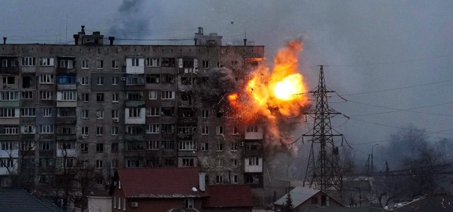An explosion is seen in an apartment building after Russian's army tank fires in Mariupol, Ukraine,