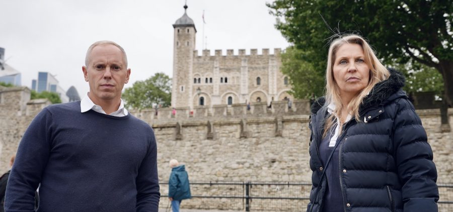Two investigators standing in front with the Tower of London in the background