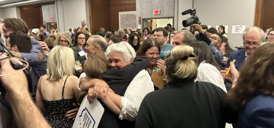 Supporters of Issue 1, the constitutional amendment to enshrine abortion and reproductive rights into Ohio's constitution, hug as the race is called for the "yes" side.