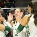 Caitlin O'Farrell high fives her teammates during Ohio's game against Eastern Michigan