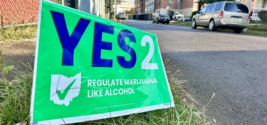 A "Yes on Issue 2" sign sits on the side of the road.
