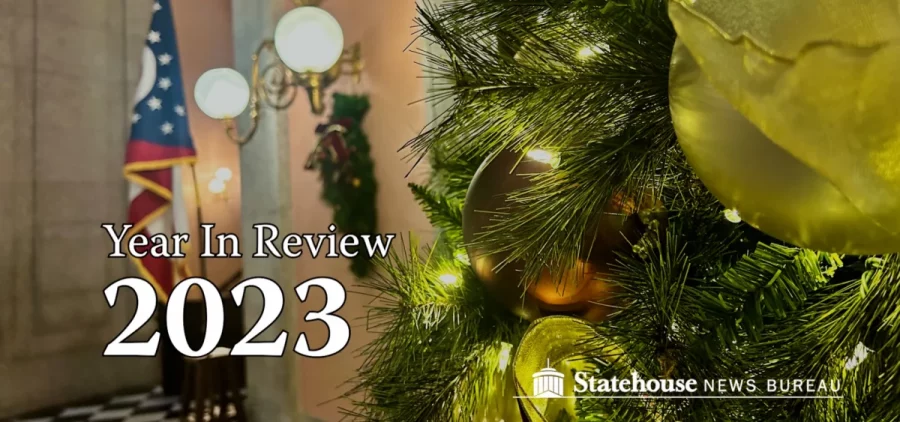 A graphic reads Year In Review 2023 with a picture of a christmas tree at the statehouse