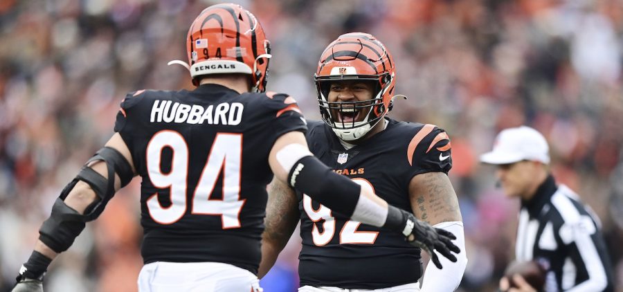 Cincinnati Bengals defensive end Sam Hubbard (94) and defensive tackle BJ Hill (92) celebrate a sack against the Cleveland Browns