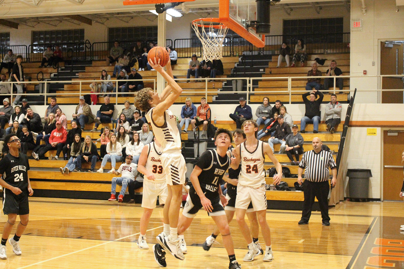 Nelsonville-York player jumps for the hoop.