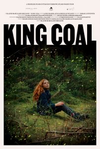 The theatrical poster for "King Coal." The poster depicts a young girl sitting in a forest. 