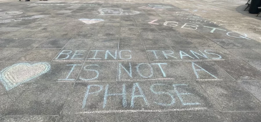 The message "being trans is not a phase" was written in chalk outside the Ohio Statehouse after a protest over a bill banning gender transition treatments for minors in May 2022.