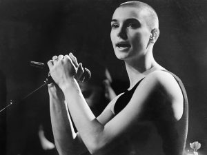 A black and white picture of Sinéad O'Connor. 