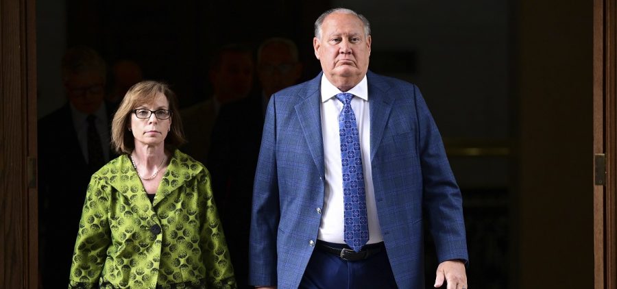 Former FirstEnergy CEO Charles Jones, right, walks with his lawyer Carole Rendon toward the courtroom at the Summit County courthouse in Akron, Ohio