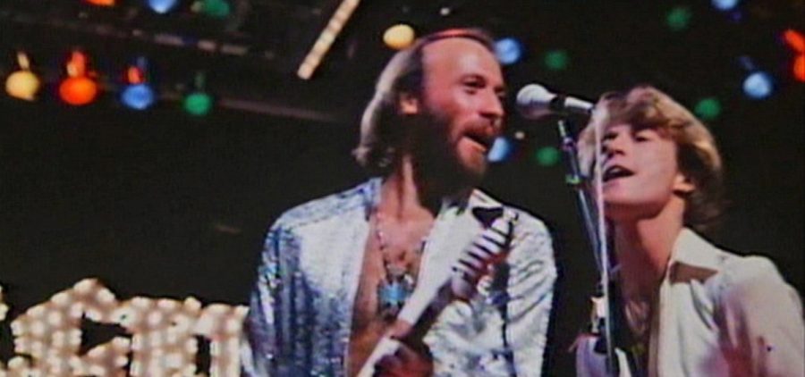 Maurice Gibb and Andy Gibb - performing on stage as a part of the Bee Gees. Credit: Mercury Studios Ltd.