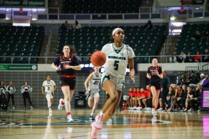 Ohio guard Kennedi Watkins (5) drives to the basket against the Ball State Cardinals.