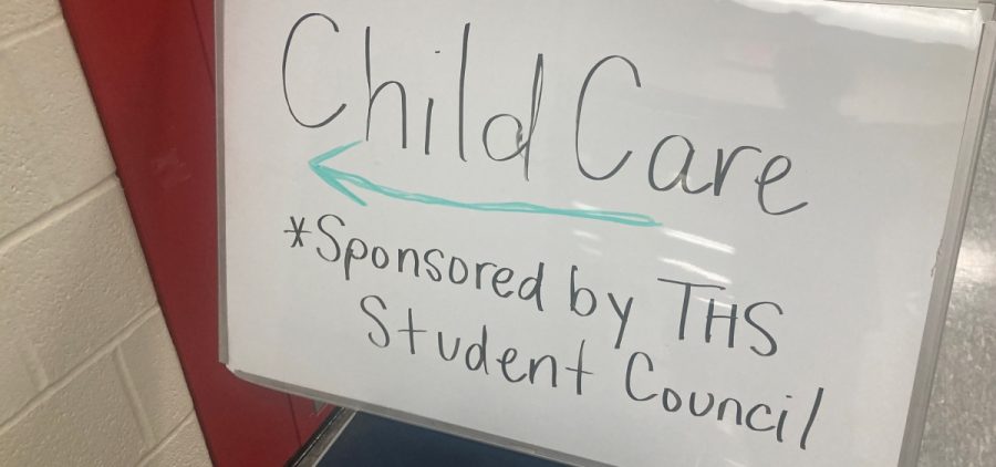 A whiteboard advertises Child Care sponsored by THS student council.