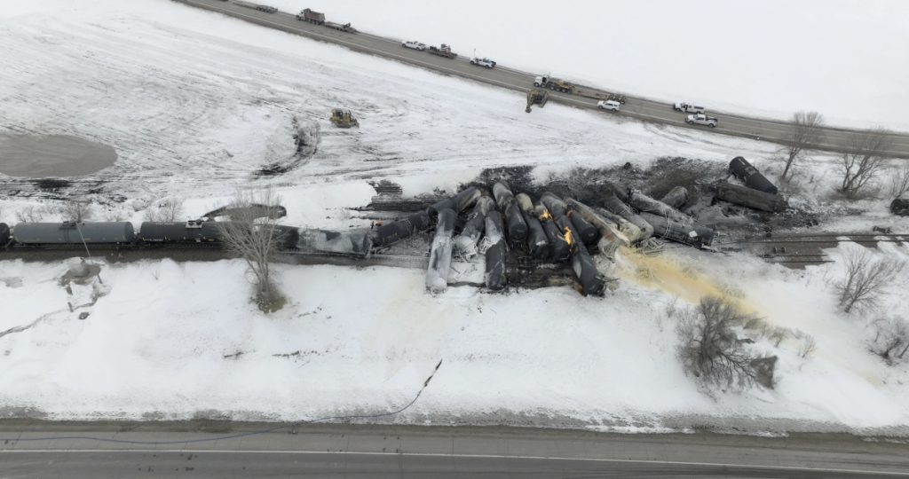 A train derailed in a snowy landscape.