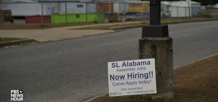 A sign advertises assembly line jobs at SL Alabama.