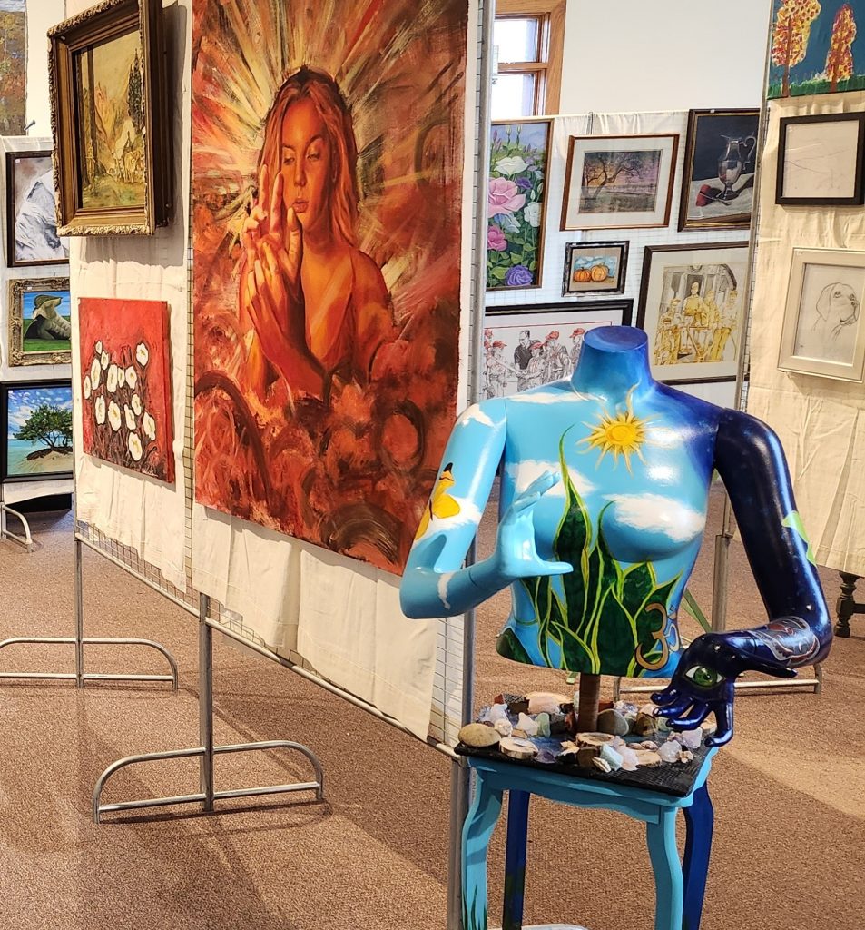 An image of various types of art on display in an art gallery.