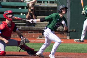 Ohio infielder Taylor Gill swing at a pitch against UIC. 